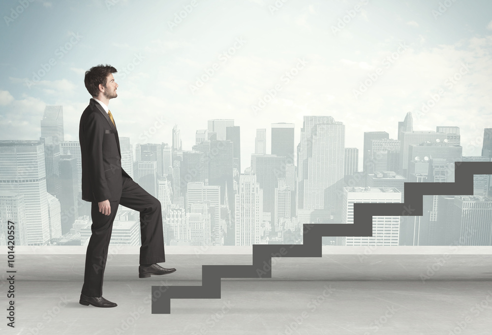 Business person in front of a staircase Business person in front of a staircase
