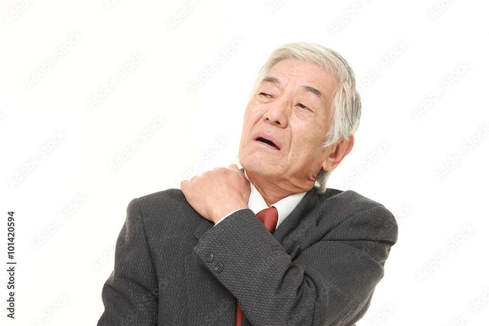 senior Japanese businessman suffers from neck ache senior Japanese businessman suffers from neck ache