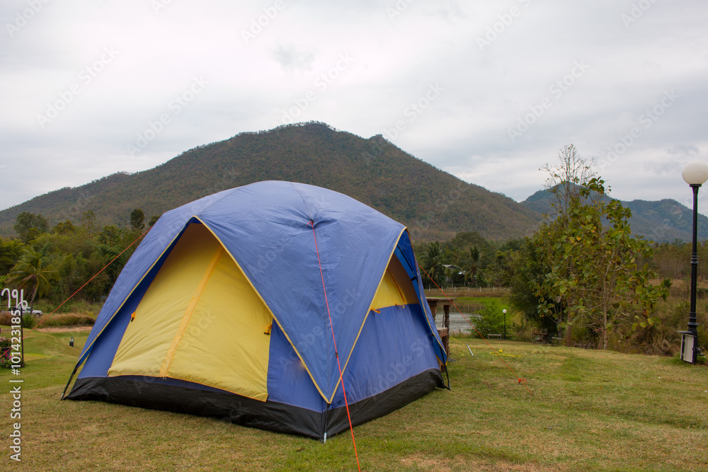 Tourist tent in camp among meadow in the mountain