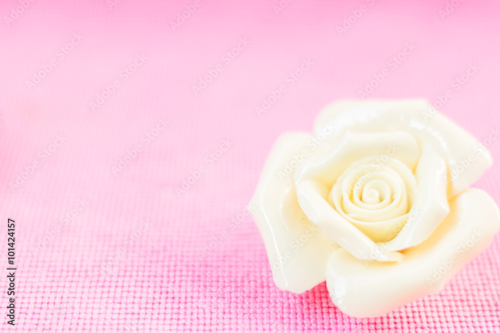 Pastel Rose (Ceramic ) on pink fabic background
