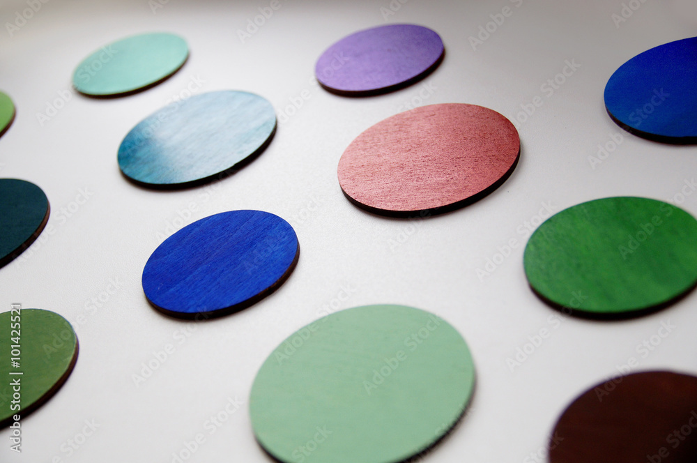 Photo of colorful wooden wheels, laser cut and hand-painted with acrylic paints Photo of colorful wooden wheels, laser cut and hand-painted with acrylic paints
