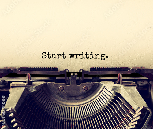 close up image of typewriter with paper sheet and the phrase: start writing . copy space for your text. terto filtered
