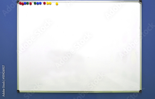 White board in blue wall background, isolated