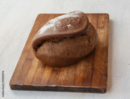 Rye bread Tabatiere on cutting board photo