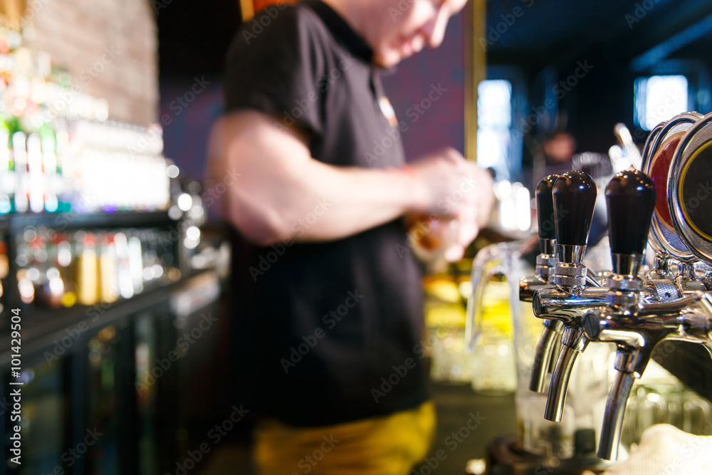 young man working as a bartender