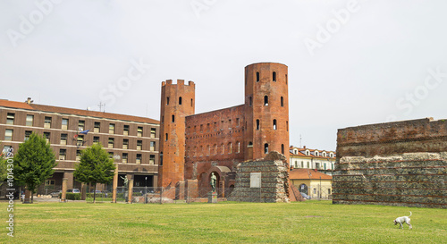 Archaeological Park with Palatine towers (Porte Palatine), ancient Roman city gates of Turin, Italy.Ruins of the ancient theater.