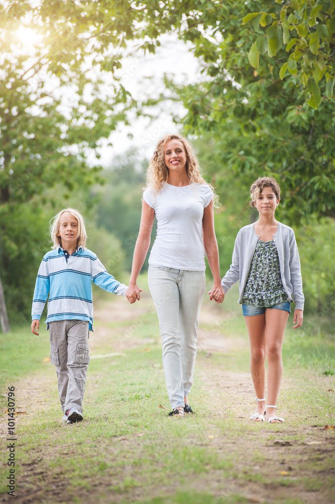 Family walking in the summer park