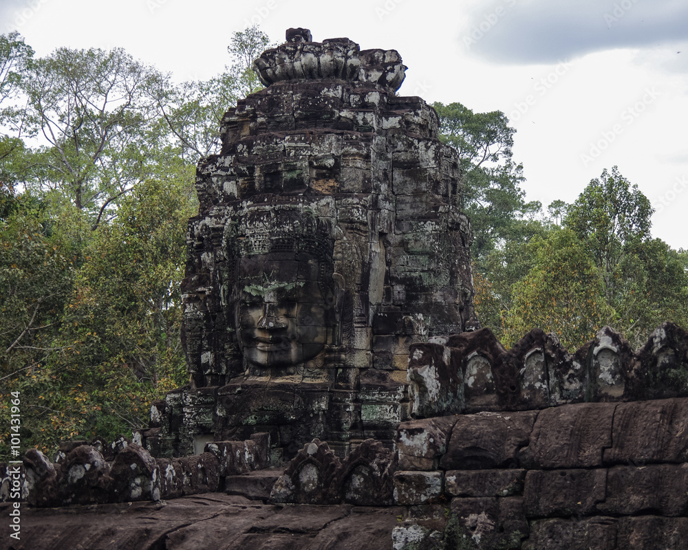 Face stone of ancient Bayon Temple in Angkor Wat, Siem Reap, Cam