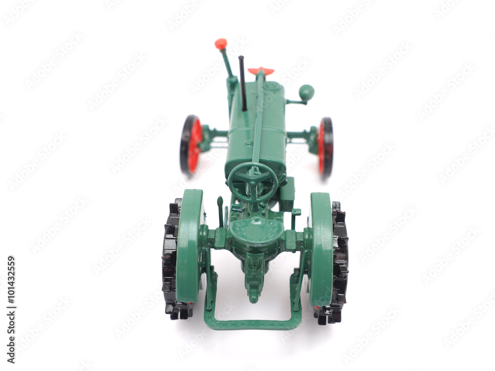 toy tractor on a white background toy tractor on a white background
