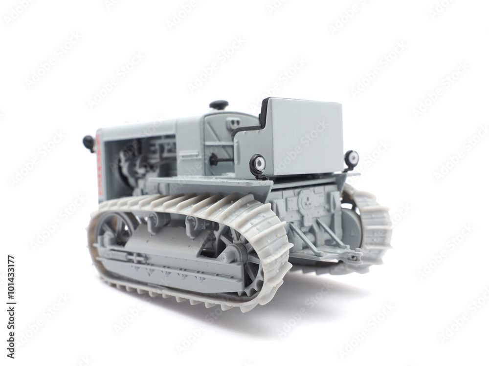 toy caterpillar tractor on a white background