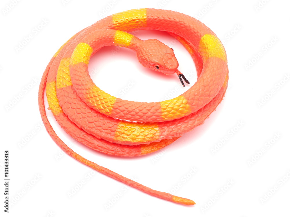 Fotografie orange toy snake on a white background