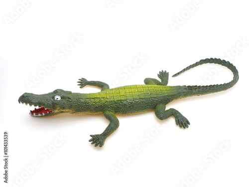 toy crocodile on a white background © enskanto