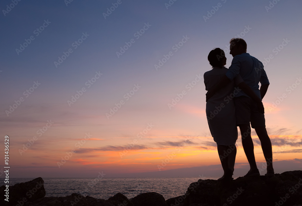 Loving couple sunset silhouette