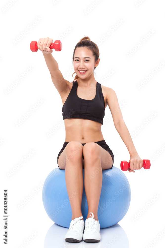 Fitness woman sport training with exercise ball and lifting weights Fitness woman sport training with exercise ball and lifting weights
