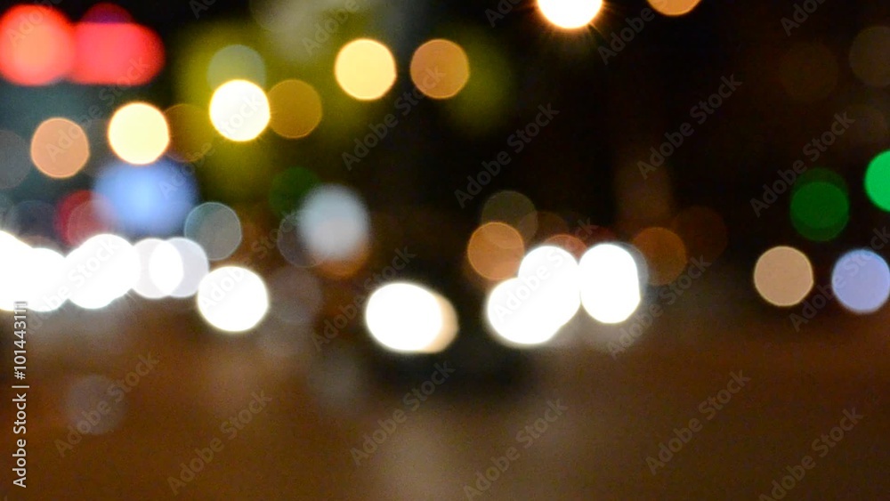 Out of focus lights of a street at night Out of focus lights of a street at night