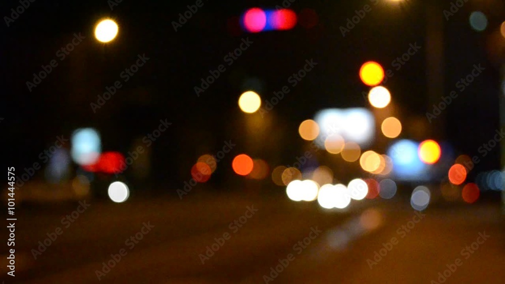 Out of focus lights of a street at night Out of focus lights of a street at night