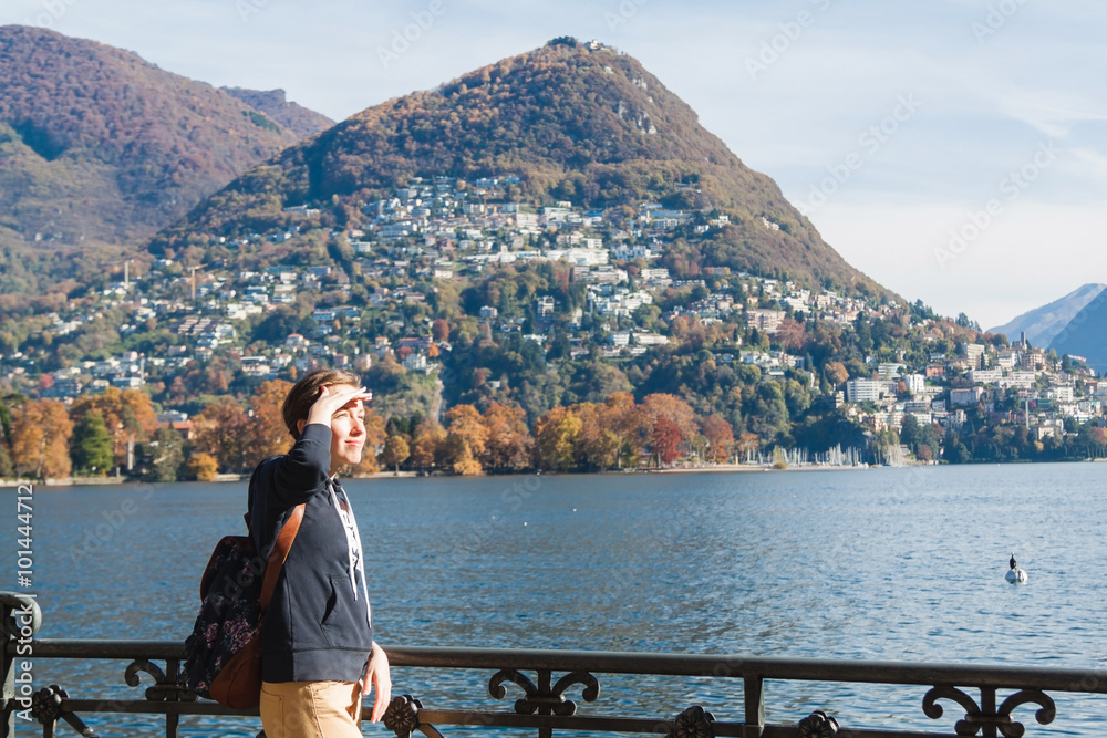 Young girl looking at the panoramic scenery. Lugano, Switzerland