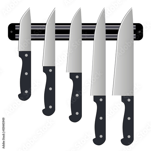 Set of knives on magnetic holder isolated on white