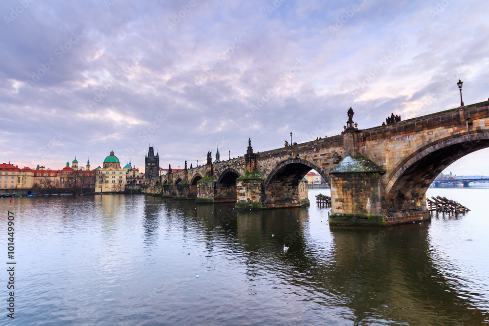 The Charles Bridge (Czech: Karluv Most) is a famous historic bridge that crosses the Vltava river in Prague, Czech Republic