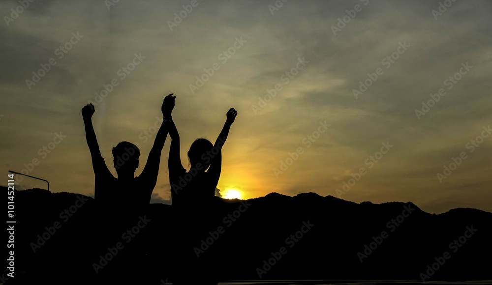 silhouette of man show arm up for achievements successful and celebrating success with sunrise silhouette of man show arm up for achievements successful and celebrating success with sunrise