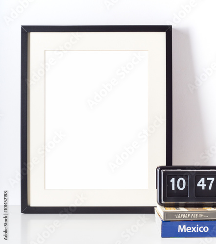 Empty picture frame on white desk