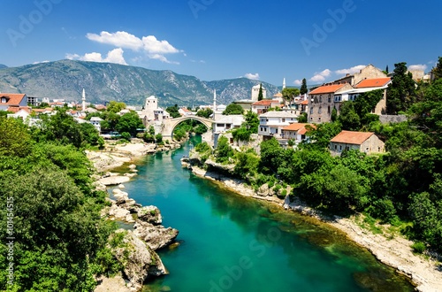 Old bridge and emerald Neretva river in Mostar, Bosnia and Herzegovina photo