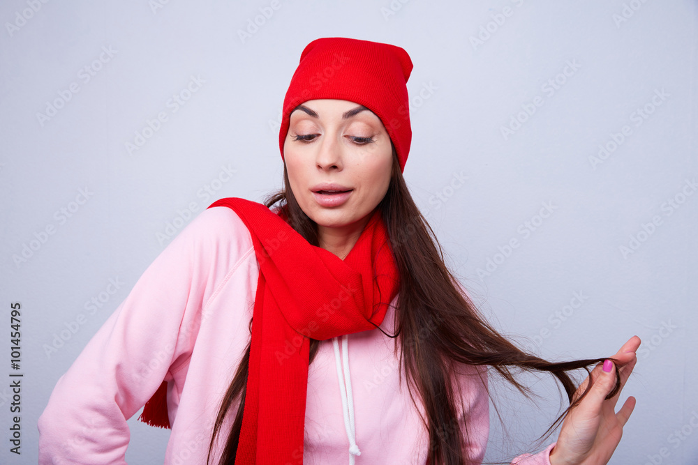 girl in a red hat and scarf smiling girl in a red hat and scarf smiling