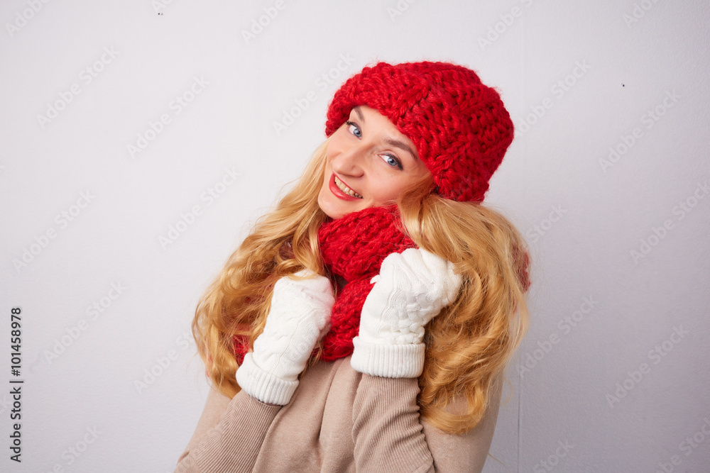 blonde in a red hat and scarf smiling blonde in a red hat and scarf smiling