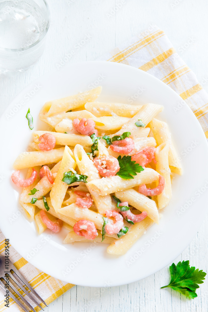 Penne pasta with shrimps, cream sauce Penne pasta with shrimps, cream sauce