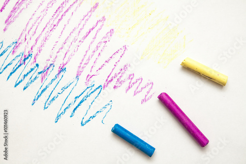multicolored crayons on a white background
