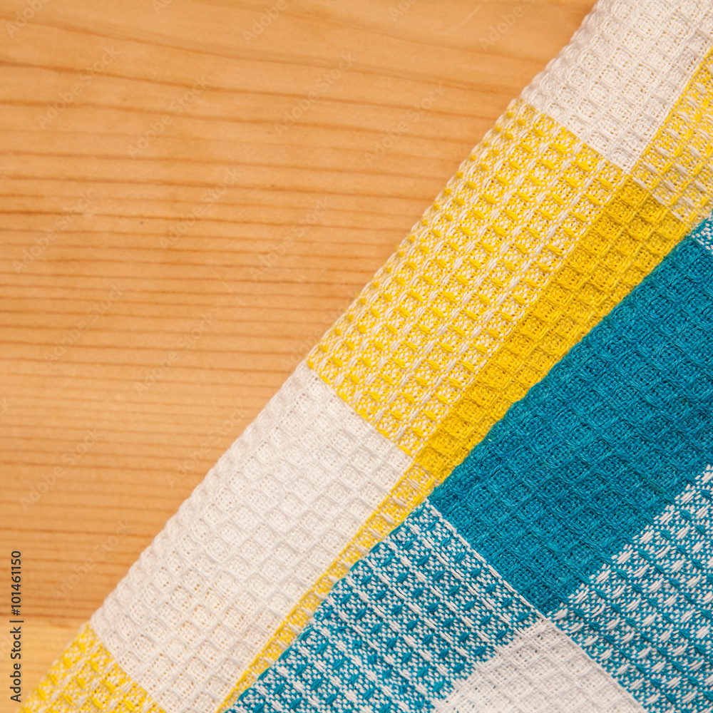 Fotografie Two checkered towels on wooden background