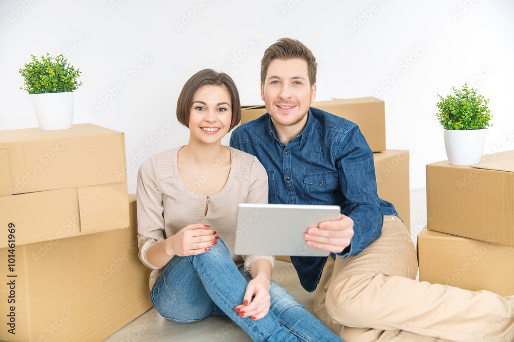 Loving couple holding tablet Loving couple holding tablet