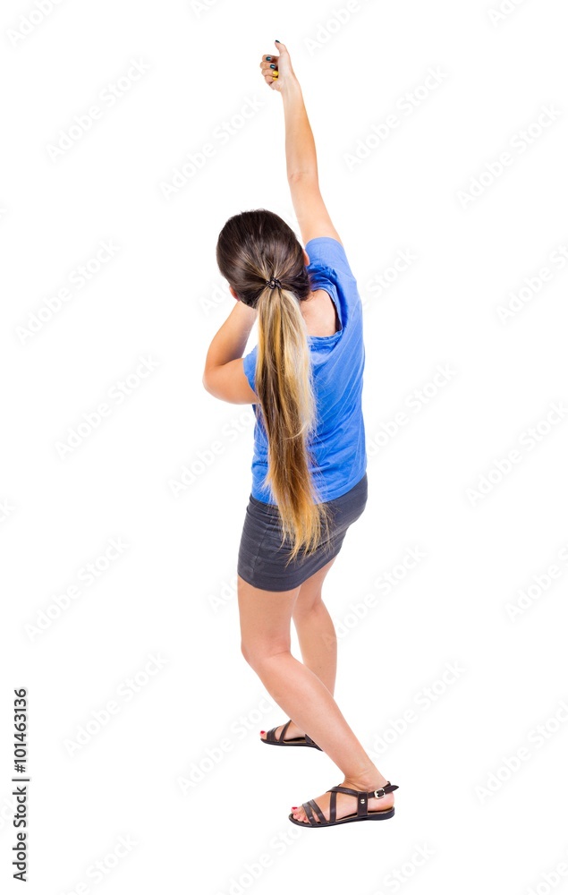 back view of standing girl pulling a rope from the top or cling back view of standing girl pulling a rope from the top or cling