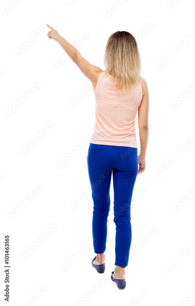 Back view of pointing woman. Back view of pointing woman.