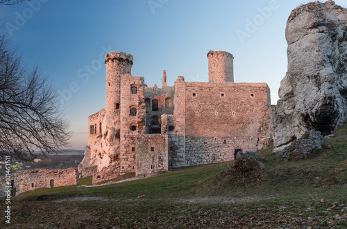 Ruins of medieval castle in Ogrodzieniec, Poland, beautifully illuminated by the sun during sunset