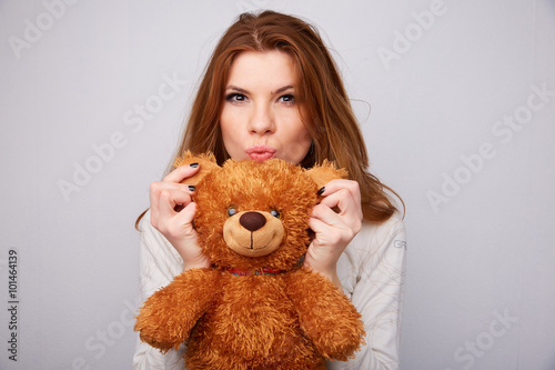 red-haired girl with a teddy bear