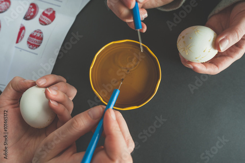 Decorating an Easter egg with wax