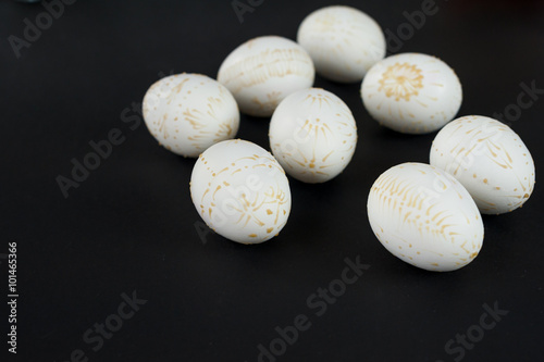 Easter eggs decorated with wax  isolated on black background