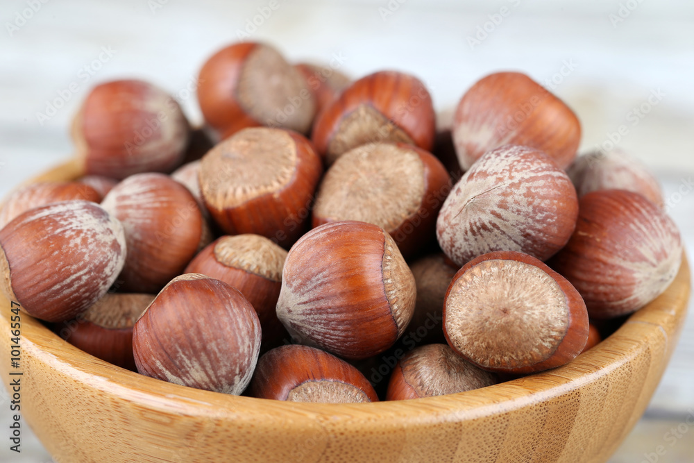 Hazelnuts in a wooden bowl