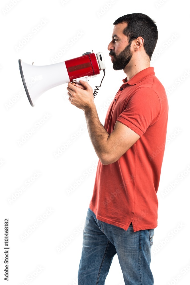 Handsome man shouting by megaphone Handsome man shouting by megaphone