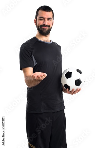 Football player holding something