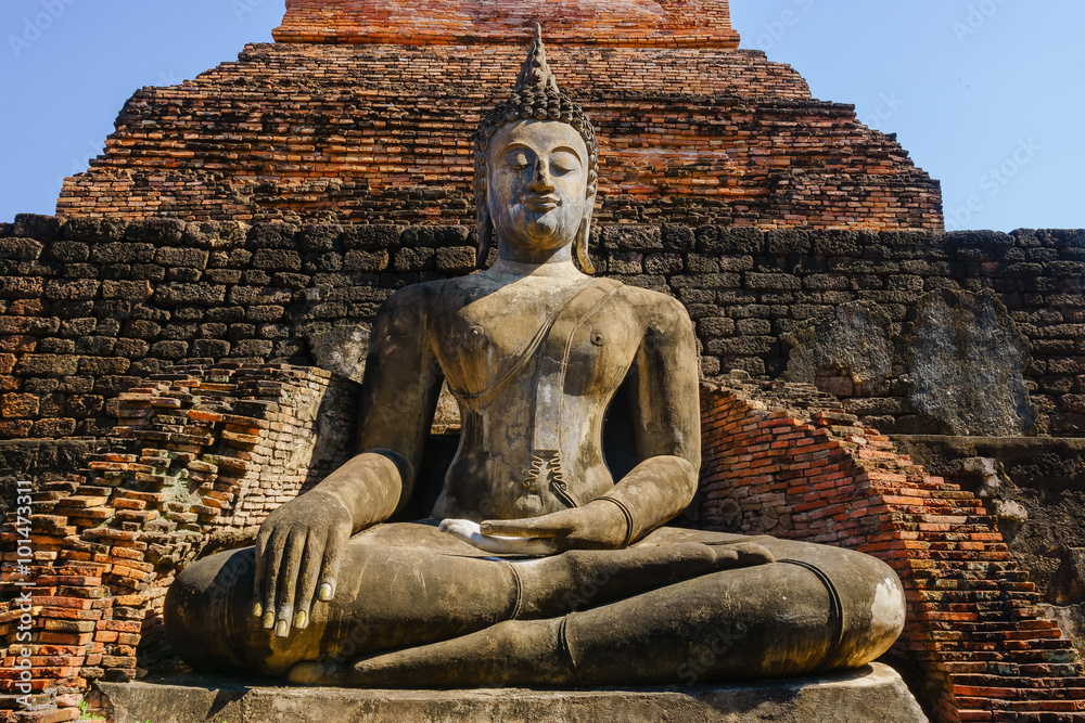 SUKHOTHAI, THAILAND - January 3, 2016: Ancient Buddha Statue at Sukhothai historical park, Mahathat Temple, Thailand. SUKHOTHAI, THAILAND - January 3, 2016: Ancient Buddha Statue at Sukhothai historical park, Mahathat Temple, Thailand.