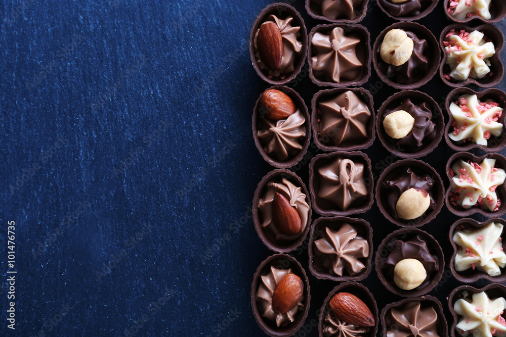 Chocolate sweets on wooden background Chocolate sweets on wooden background