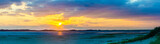 Sunset Ponorama at the beach, Sylt, List, Germany.
View from Uethoern over the Koenigshafen to List at low tide. In the middle of the image tidal flat and mussel beds.