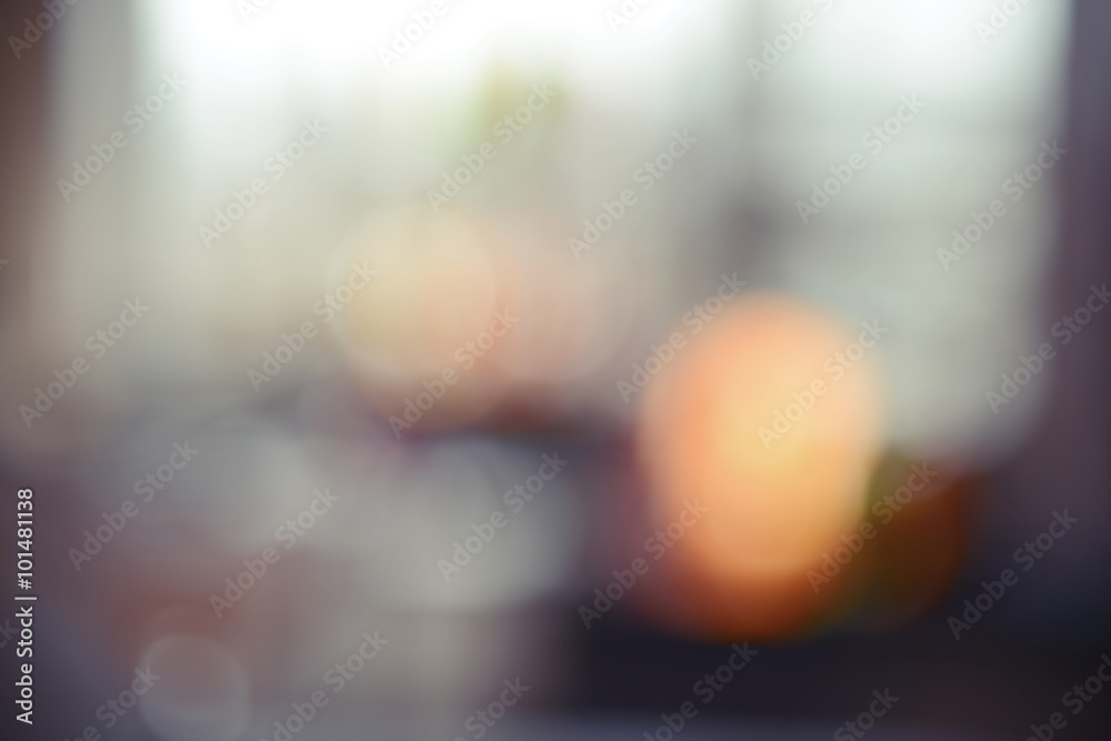 Glass of cocktail on bar, blurred background