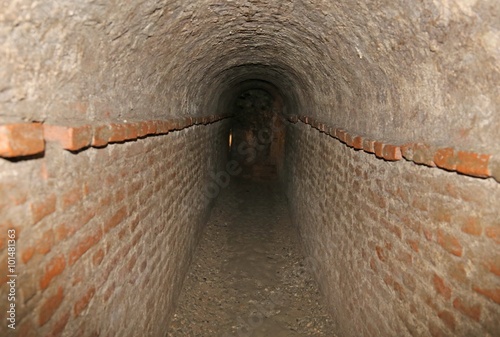 Fototapet brick tunnel of a secret underground passage