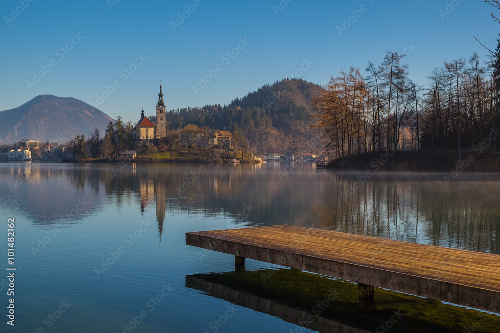 A wooden dock, pier, on a lake