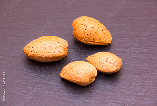 Almonds on a slate seen up close