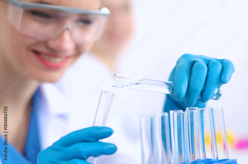Woman researcher is surrounded by medical vials and flasks, isolated on white background Woman researcher is surrounded by medical vials and flasks, isolated on white background