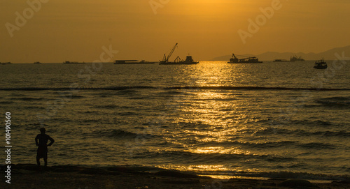 Ships at anchor as the sun sets